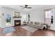 Comfortable living room with a fireplace, plush sofa, and stylish decor, ideal for relaxation and gatherings at 221 Trillium Ave, Summerville, SC 29483