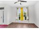 Bright living room with large windows, modern ceiling fan, and stylish floors, perfect for relaxation and entertaining at 221 Trillium Ave, Summerville, SC 29483