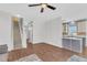 Open concept living space with wood floors, staircase and views into the kitchen at 221 Trillium Ave, Summerville, SC 29483