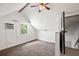 Attic with a small window, neutral colors, carpet, and stairs at 225 Baxter Ln, Walterboro, SC 29488