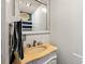 Bathroom with ornate marble-style vanity with tan sink and mirror at 225 Baxter Ln, Walterboro, SC 29488