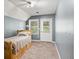 A gray walled bedroom features wood laminate floors and natural light at 225 Baxter Ln, Walterboro, SC 29488