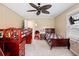 A bedroom with wooden bunk beds, a ceiling fan, carpet, and window at 225 Baxter Ln, Walterboro, SC 29488