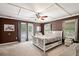 Bedroom featuring brown walls, neutral carpet, and wicker furniture at 225 Baxter Ln, Walterboro, SC 29488
