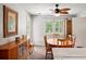 Bright dining room with natural light, wood flooring, ceiling fan, and classic wood furnishings at 225 Baxter Ln, Walterboro, SC 29488