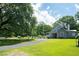 A charming home set back from the road, featuring well-maintained lawn and mature trees at 225 Baxter Ln, Walterboro, SC 29488