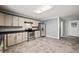 A spacious kitchen featuring light gray cabinets, stainless steel appliances, and light gray walls at 225 Baxter Ln, Walterboro, SC 29488
