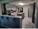 Open-concept kitchen with shaker cabinets, stainless appliances, granite countertops, backsplash and tile flooring at 225 Baxter Ln, Walterboro, SC 29488