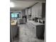 Spacious renovated kitchen with stainless steel appliances, ample cabinet storage, and updated fixtures at 225 Baxter Ln, Walterboro, SC 29488