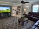 Comfortable living room with a TV and an open view into the kitchen, with modern decor at 225 Baxter Ln, Walterboro, SC 29488