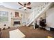 Inviting living room featuring a fireplace, neutral tones, and staircase access at 225 Baxter Ln, Walterboro, SC 29488