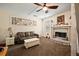 A cozy living room features a fireplace, a leather sofa, and neutral tones at 225 Baxter Ln, Walterboro, SC 29488