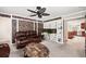 Inviting living room with exposed brick accents, built-in shelves, and a comfortable leather sofa at 225 Baxter Ln, Walterboro, SC 29488