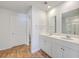 Bathroom features double sinks, white cabinets and wood look floors at 260 Sweet Cherry Ln, Summerville, SC 29486