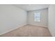 A bright bedroom featuring neutral carpet, a window with blinds, and ample natural light at 260 Sweet Cherry Ln, Summerville, SC 29486
