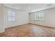 Well-lit bedroom featuring wood-look flooring, large windows, and neutral walls at 260 Sweet Cherry Ln, Summerville, SC 29486