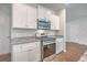 Bright kitchen features white cabinets, stainless steel appliances, and granite countertops at 260 Sweet Cherry Ln, Summerville, SC 29486