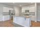 Gourmet kitchen featuring a large island, stainless steel appliances, and granite countertops at 260 Sweet Cherry Ln, Summerville, SC 29486