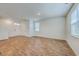 Expansive living area featuring durable wood-look flooring, bright white walls, and plenty of natural light at 260 Sweet Cherry Ln, Summerville, SC 29486