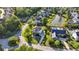Aerial view of a home with in-ground pool, deck, patio, lush landscaping and neighborhood pond at 3011 River Vista Way, Mount Pleasant, SC 29466