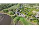 Aerial view of a golf course and clubhouse with lush green landscaping and trees at 3011 River Vista Way, Mount Pleasant, SC 29466