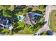 Aerial view of a home with in-ground pool, deck, patio, and lush landscaping at 3011 River Vista Way, Mount Pleasant, SC 29466