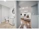 Basement bathroom and living area with laminated wood flooring at 3011 River Vista Way, Mount Pleasant, SC 29466