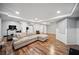 Large basement with a comfortable seating area with laminated wood flooring at 3011 River Vista Way, Mount Pleasant, SC 29466