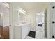 Bathroom with white cabinetry and countertop space offering an open doorway view of a bedroom at 3011 River Vista Way, Mount Pleasant, SC 29466