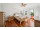 Bright bedroom with hardwood floors, white trim, and large windows providing lots of light at 3011 River Vista Way, Mount Pleasant, SC 29466