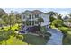 Spacious two-story home with double balconies, stairs, palm trees, and driveway leading to attached garage at 3011 River Vista Way, Mount Pleasant, SC 29466