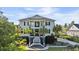 Charming two-story home featuring a double front porch, white columns and professionally landscaped yard at 3011 River Vista Way, Mount Pleasant, SC 29466