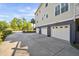 Three-car garage with long driveway in this neutral toned two story house at 3011 River Vista Way, Mount Pleasant, SC 29466