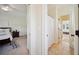 Hallway view with access to the bathroom with shower and bedroom with ceiling fan and bed at 3011 River Vista Way, Mount Pleasant, SC 29466