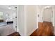 Hallway with hardwood flooring and access to carpeted bedroom with closet space at 3011 River Vista Way, Mount Pleasant, SC 29466
