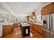 Well-appointed kitchen with custom wood cabinets, stainless steel appliances, and marble countertops at 3011 River Vista Way, Mount Pleasant, SC 29466