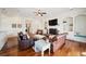 Bright living room featuring a brick fireplace, built-in shelving, and comfortable seating at 3011 River Vista Way, Mount Pleasant, SC 29466