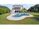 Backyard features a kidney-shaped pool, patio, and deck access to the second story at 3011 River Vista Way, Mount Pleasant, SC 29466