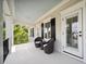 Relaxing outdoor porch with seating, complemented by a light blue ceiling at 3011 River Vista Way, Mount Pleasant, SC 29466