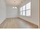 Inviting dining room with modern chandelier and bright window views at 3118 Vanessa Lynne Blvd, Johns Island, SC 29455