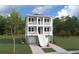 Beautiful two-story home with double porches and stairs leading from driveway at 3118 Vanessa Lynne Blvd, Johns Island, SC 29455