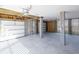 Spacious garage featuring concrete flooring, cinder block columns, and garage door with automatic opener at 3118 Vanessa Lynne Blvd, Johns Island, SC 29455