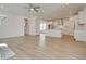 Bright kitchen view from living space with white cabinets, island and pendant lighting at 3118 Vanessa Lynne Blvd, Johns Island, SC 29455