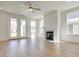 Bright living room with fireplace, large windows, and wood floors at 3118 Vanessa Lynne Blvd, Johns Island, SC 29455