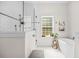 Bright bathroom featuring a walk-in shower, soaking tub, and stylish fixtures at 32 Middleton Oaks Rd, Charleston, SC 29414