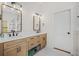 Stylish bathroom featuring double vanity with wood cabinets and modern fixtures at 32 Middleton Oaks Rd, Charleston, SC 29414