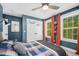 Chic bedroom features a blue accent wall, natural lighting and neutral color palette at 32 Middleton Oaks Rd, Charleston, SC 29414