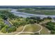 An elevated view of the property showcases extensive landscaping, waterways, and the surrounding natural beauty at 32 Middleton Oaks Rd, Charleston, SC 29414