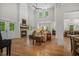 Bright living room with a fireplace, comfortable seating, hardwood floors, and double doors to the outdoor space at 32 Middleton Oaks Rd, Charleston, SC 29414