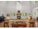 Bright living room featuring hardwood floors, a fireplace, white shiplap walls, and comfortable seating at 32 Middleton Oaks Rd, Charleston, SC 29414